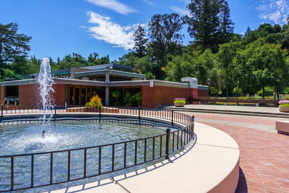 Water fountain in Los Gatos Civic Center; the Town Hall building visible in the background; south San Francisco bay area, California
